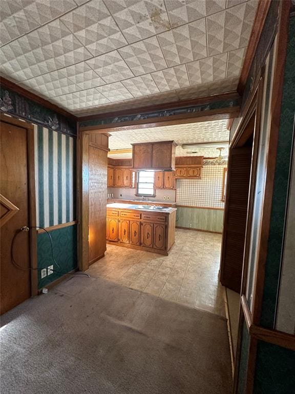 kitchen with light colored carpet