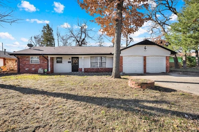 ranch-style home with a garage, concrete driveway, and brick siding