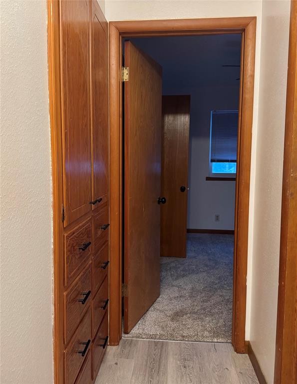 corridor featuring light hardwood / wood-style floors