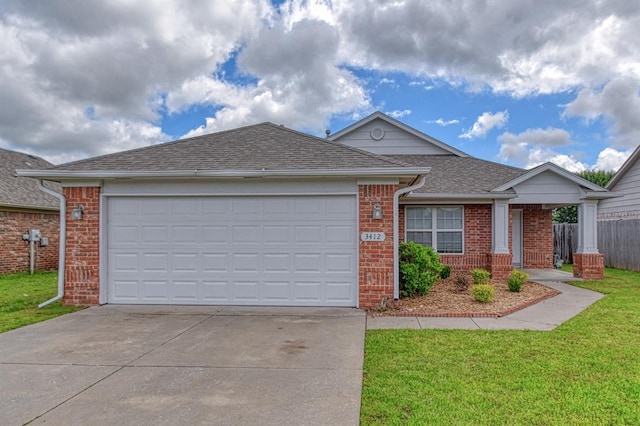 ranch-style home with driveway, brick siding, a garage, and roof with shingles