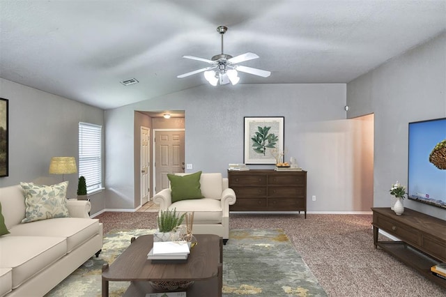 living area featuring lofted ceiling, carpet, a ceiling fan, and baseboards