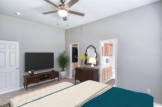 bedroom with a walk in closet, a closet, carpet floors, a ceiling fan, and ensuite bath