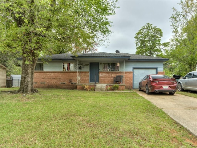 ranch-style home with a garage and a front lawn