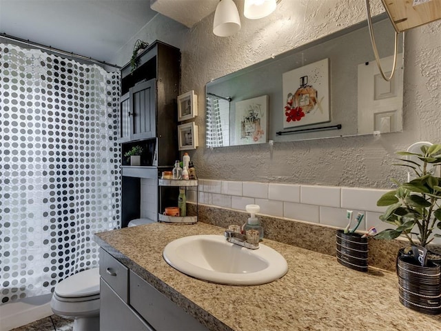 full bathroom with vanity, toilet, and shower / bath combo with shower curtain