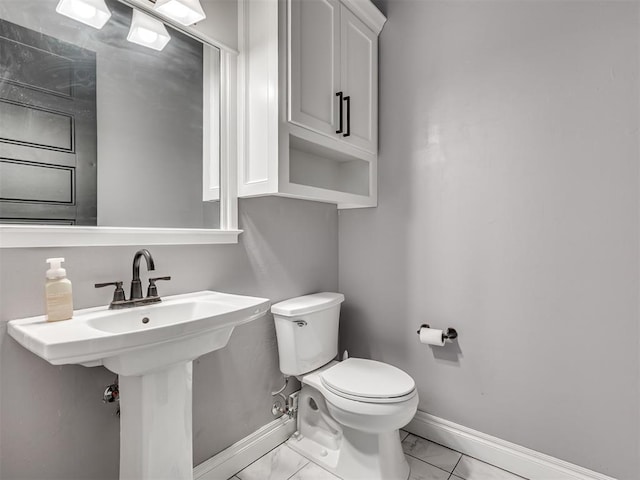 bathroom with sink and toilet