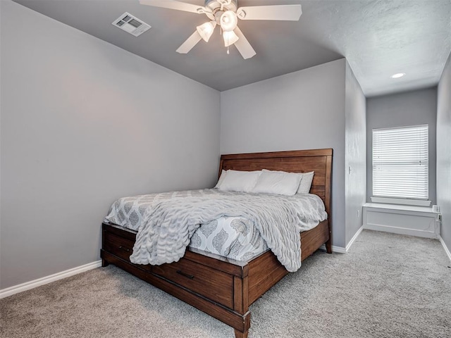 bedroom with light carpet and ceiling fan