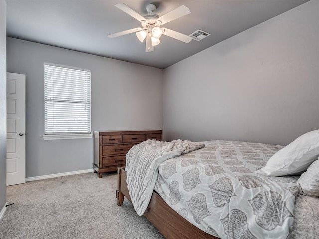 bedroom with light colored carpet and ceiling fan