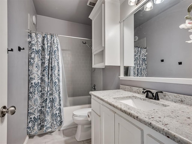 full bathroom featuring vanity, tile patterned flooring, shower / bath combo, and toilet