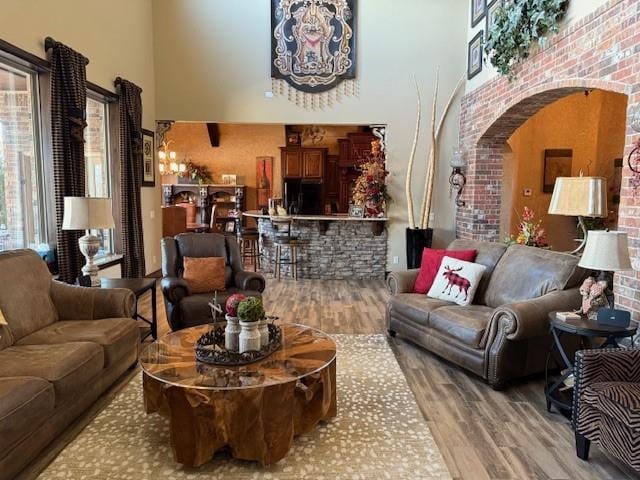 interior space featuring a high ceiling and wood-type flooring