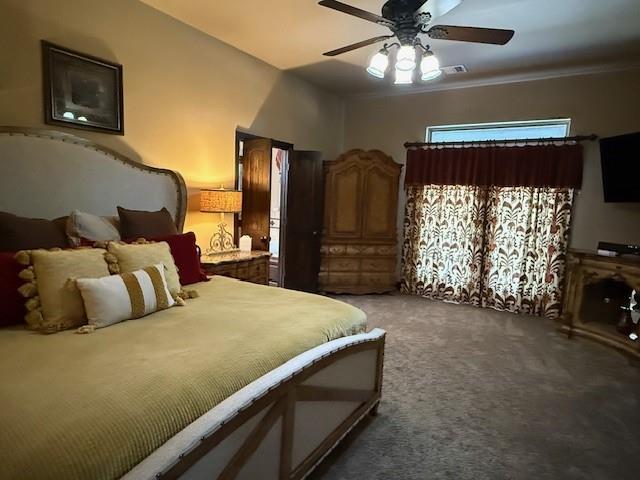 bedroom with dark carpet and ceiling fan