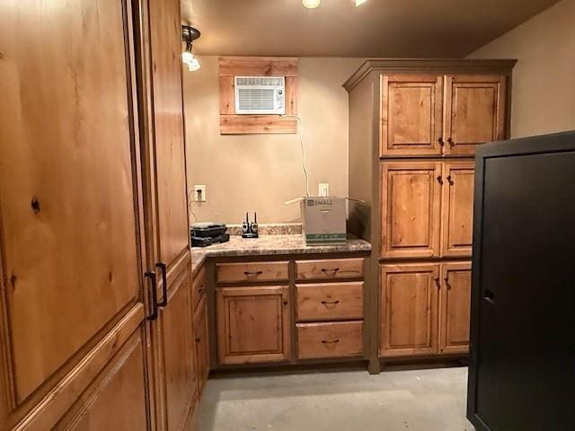 kitchen with pendant lighting and a wall unit AC