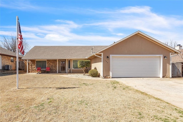 single story home featuring an attached garage, central air condition unit, concrete driveway, stone siding, and roof with shingles