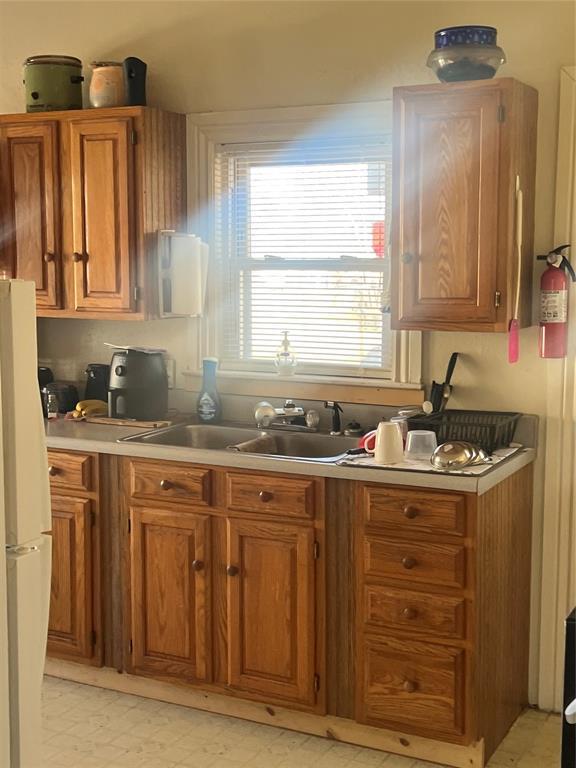 506 N Broadway St, Marlow, OK 73055 - kitchen featuring white refrigerator and sink