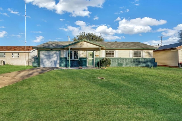 ranch-style house featuring a garage and a front lawn