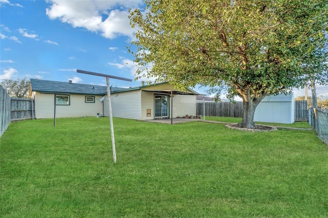 view of yard with a storage unit and a patio