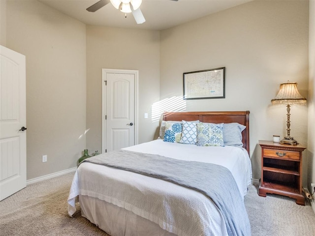 carpeted bedroom with baseboards and a ceiling fan