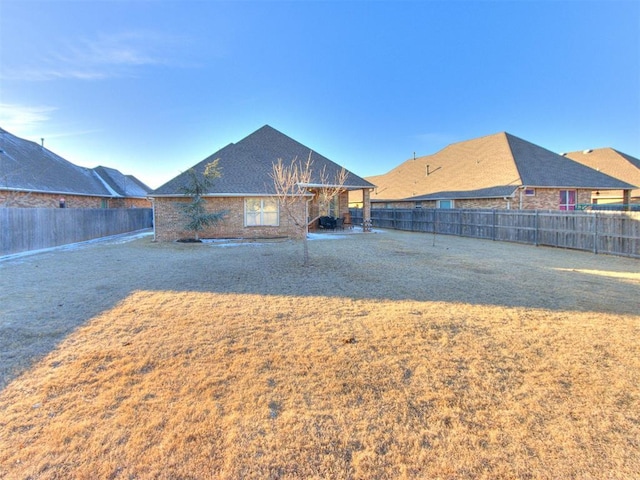 view of yard featuring a fenced backyard