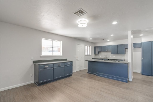 kitchen with light hardwood / wood-style flooring