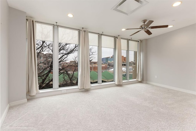5900 Mosteller Dr Unit St32, Oklahoma City, OK 73112 - empty room featuring light carpet and plenty of natural light
