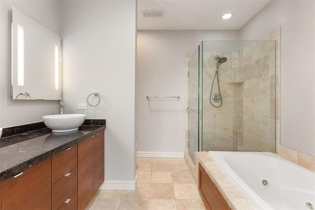 5900 Mosteller Dr Unit St32, Oklahoma City, OK 73112 - full bath with visible vents, baseboards, a shower stall, vanity, and a whirlpool tub