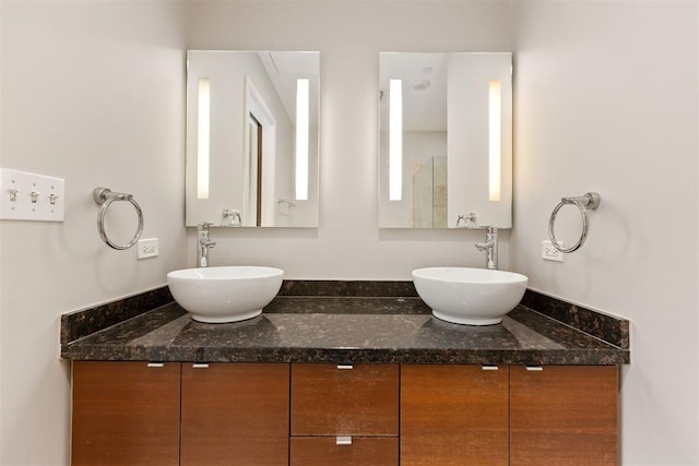 5900 Mosteller Dr Unit St32, Oklahoma City, OK 73112 - bathroom featuring double vanity and a sink