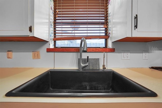 room details with sink and white cabinets