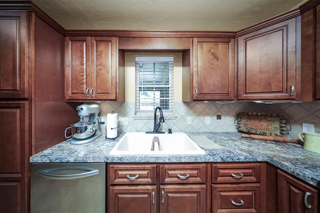 kitchen with stainless steel dishwasher, sink, decorative backsplash, and dark stone countertops