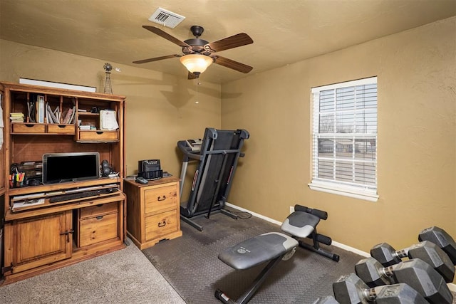 404 N Bryan Ave, Mangum, OK 73554 - workout room featuring dark colored carpet and ceiling fan
