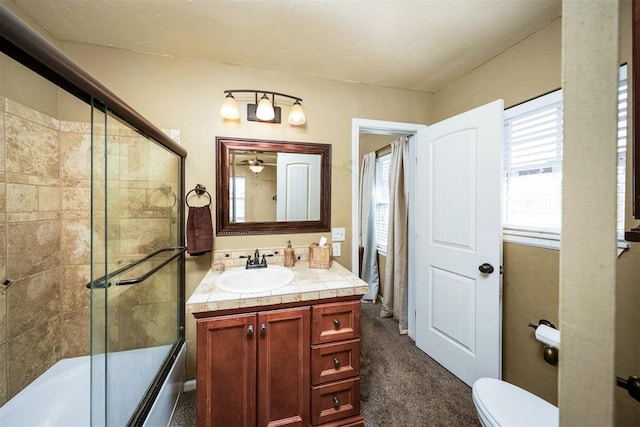 404 N Bryan Ave, Mangum, OK 73554 - bathroom with vanity, combined bath / shower with glass door, and ceiling fan