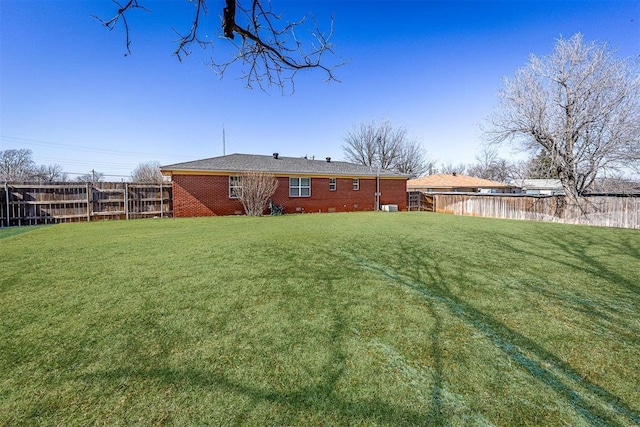 404 N Bryan Ave, Mangum, OK 73554 - back of house with brick siding and a fenced backyard