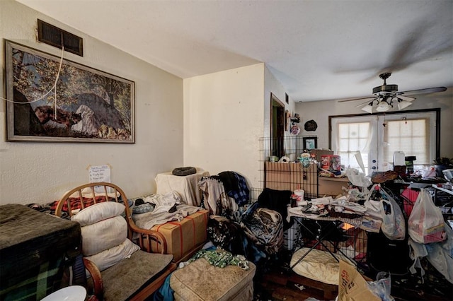 living room featuring a ceiling fan, french doors, and visible vents