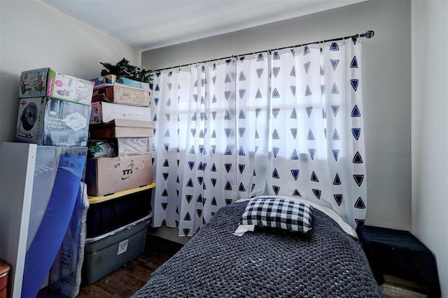 bedroom with wood finished floors