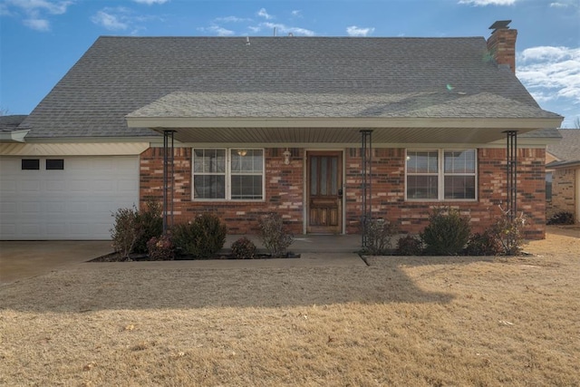 view of front of home featuring a garage and a front lawn