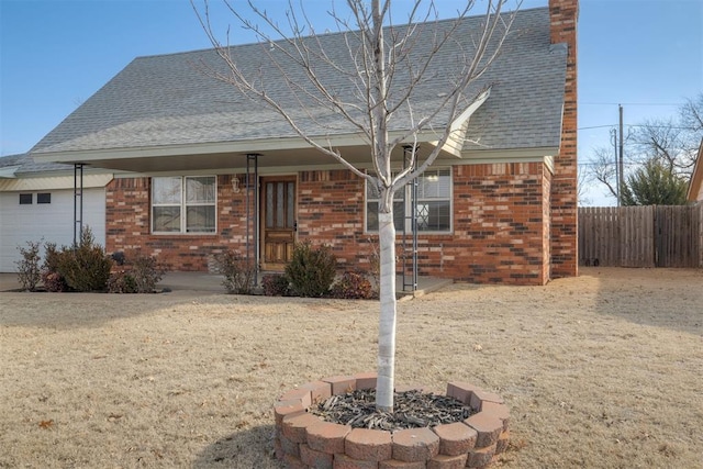 view of front of home featuring an outdoor fire pit and a garage