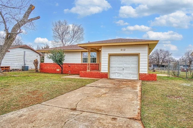 ranch-style house featuring a garage and a front yard