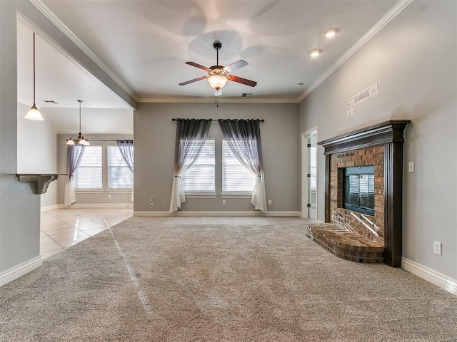 unfurnished living room with light carpet, a fireplace, ornamental molding, and ceiling fan