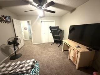 interior space with ceiling fan and carpet flooring