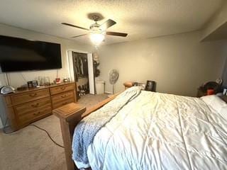 bedroom with a ceiling fan and carpet floors