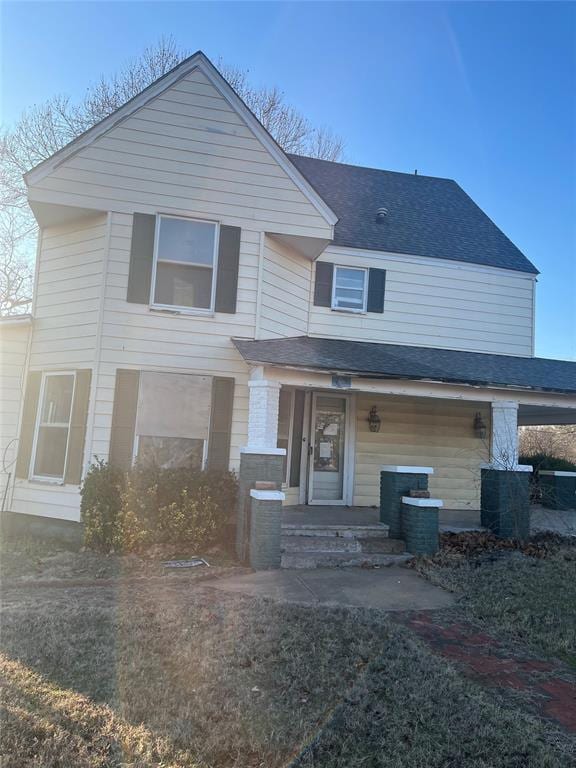 view of front of home featuring covered porch and central air condition unit