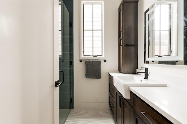 bathroom featuring a stall shower, tile patterned floors, and vanity