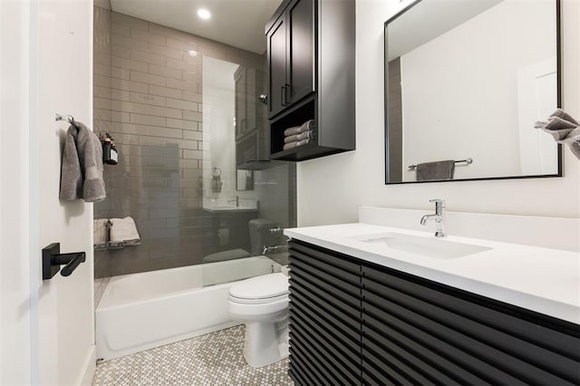 full bathroom with shower / bath combination with glass door, vanity, toilet, and tile patterned floors