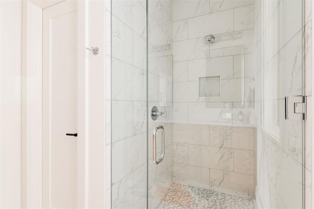 bathroom with a shower stall