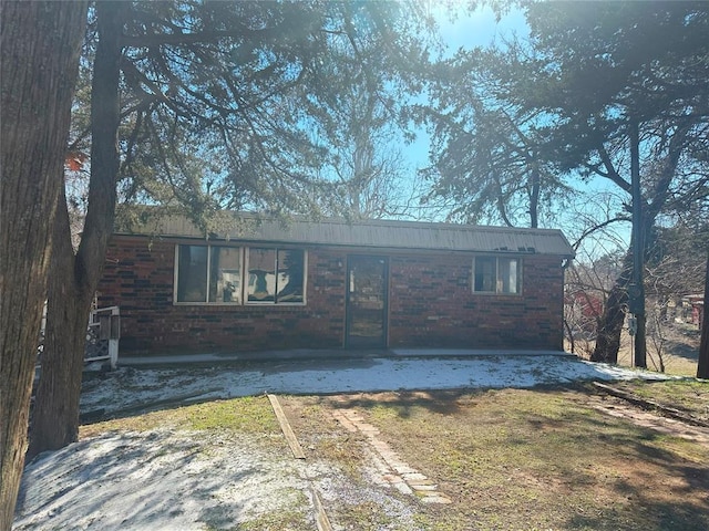 view of front of house featuring brick siding