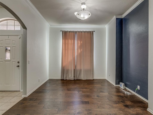 entryway featuring ornamental molding and dark wood-type flooring