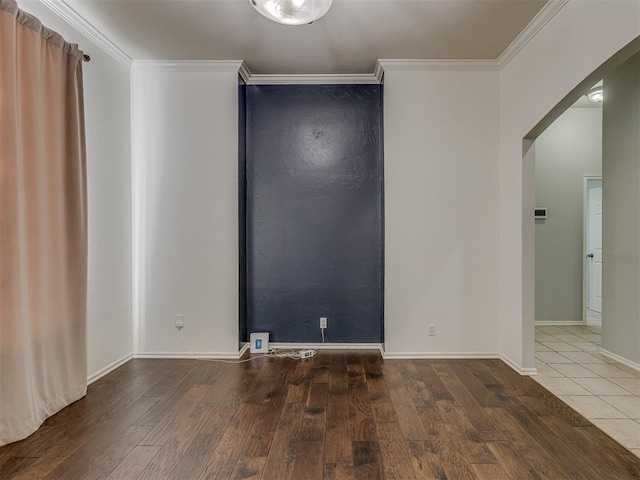 unfurnished room featuring wood-type flooring and ornamental molding