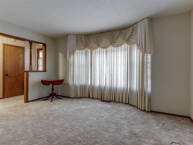 7000 N Libby Ave, Oklahoma City, OK 73132 - unfurnished room with light carpet and a textured ceiling