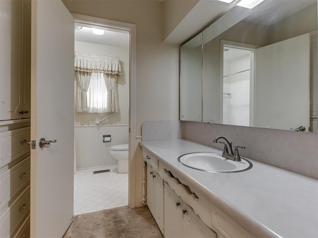 7000 N Libby Ave, Oklahoma City, OK 73132 - bathroom with vanity, toilet, and tile patterned flooring