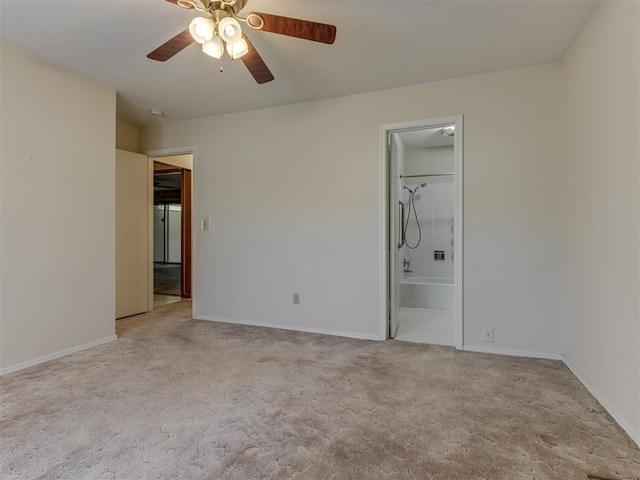 7000 N Libby Ave, Oklahoma City, OK 73132 - unfurnished bedroom with ceiling fan, light carpet, and ensuite bath