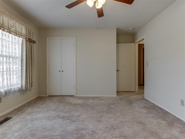 7000 N Libby Ave, Oklahoma City, OK 73132 - unfurnished bedroom with light colored carpet, a closet, and ceiling fan