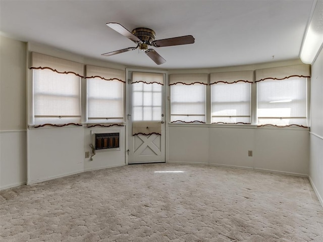 7000 N Libby Ave, Oklahoma City, OK 73132 - empty room featuring heating unit, light colored carpet, and ceiling fan